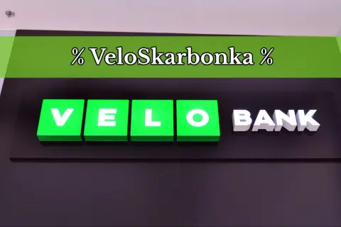 Logo VeloSkarbonka i napis BANK na ciemnym tle.