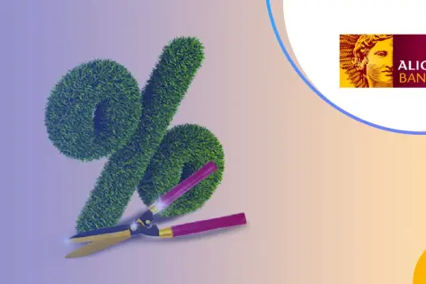 Zielony znak procent z nożycami i logo Alior Bank.