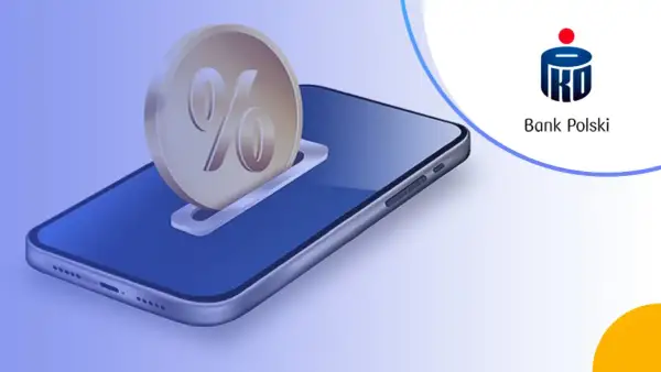 Grafika przedstawia monetę z symbolem procentu wsuwaną do slotu w smartfonie.